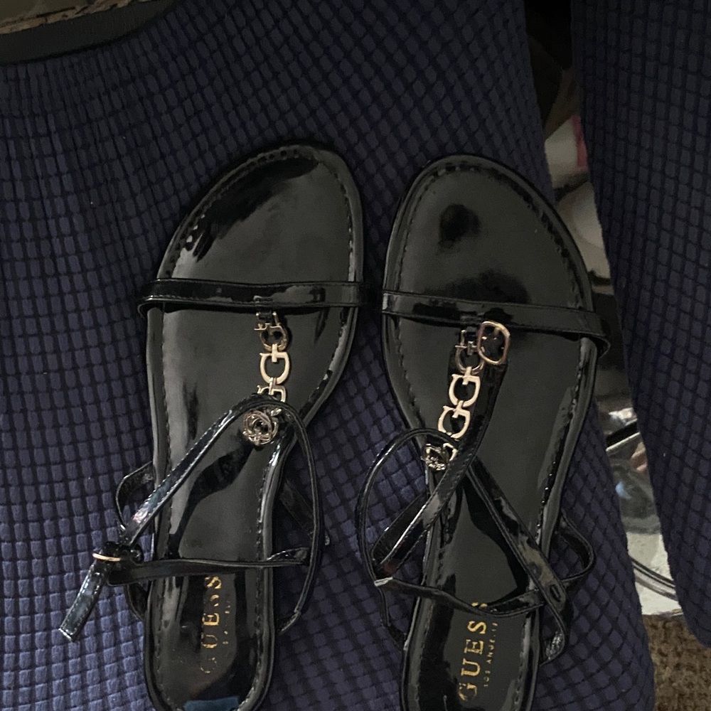 GUESS Black Patent T-Strap Sandals with Gold Chain Detail